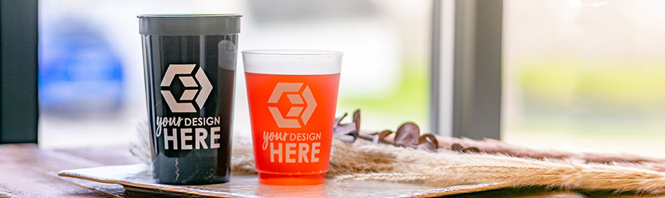 Black stadium cup with white imprint and frosted plastic cup with white imprint